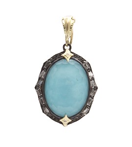 Blue gemstone pendant surrounded by darker sterling silver, created by Armenta