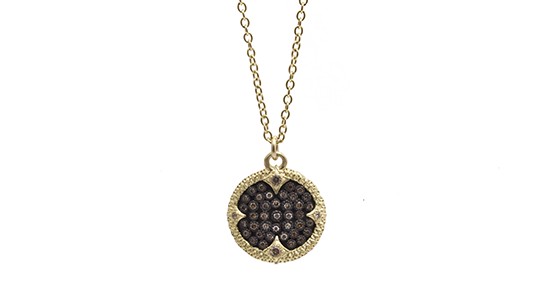 A yellow gold pendant necklace by Armenta featuring brown diamonds
