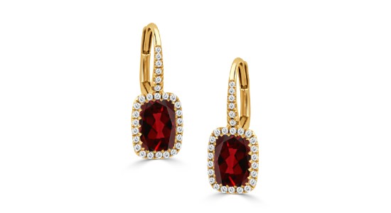 A pair of yellow gold drop earrings featuring deep red garnets and diamond accents